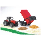 Massey Ferguson 7480 con remolque de Bruder descargando grano durante una tarea agrícola.