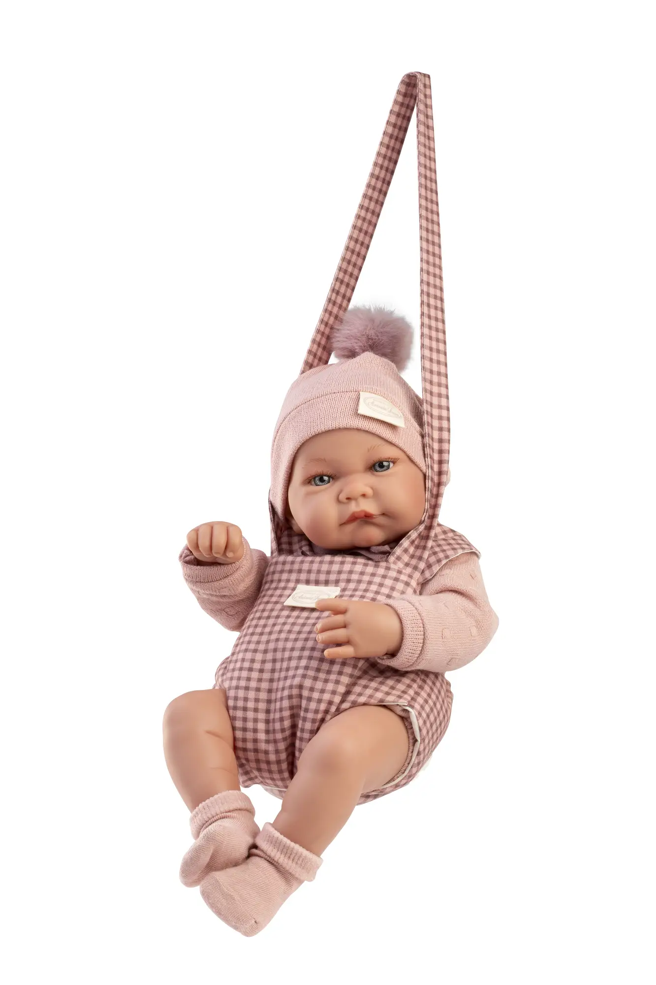 Muñeca Recién Nacida Nica suspendida en el Portabebé de Antonio Juan, de 42 cm, con cuerpo de vinilo sexuado y tacto especial.