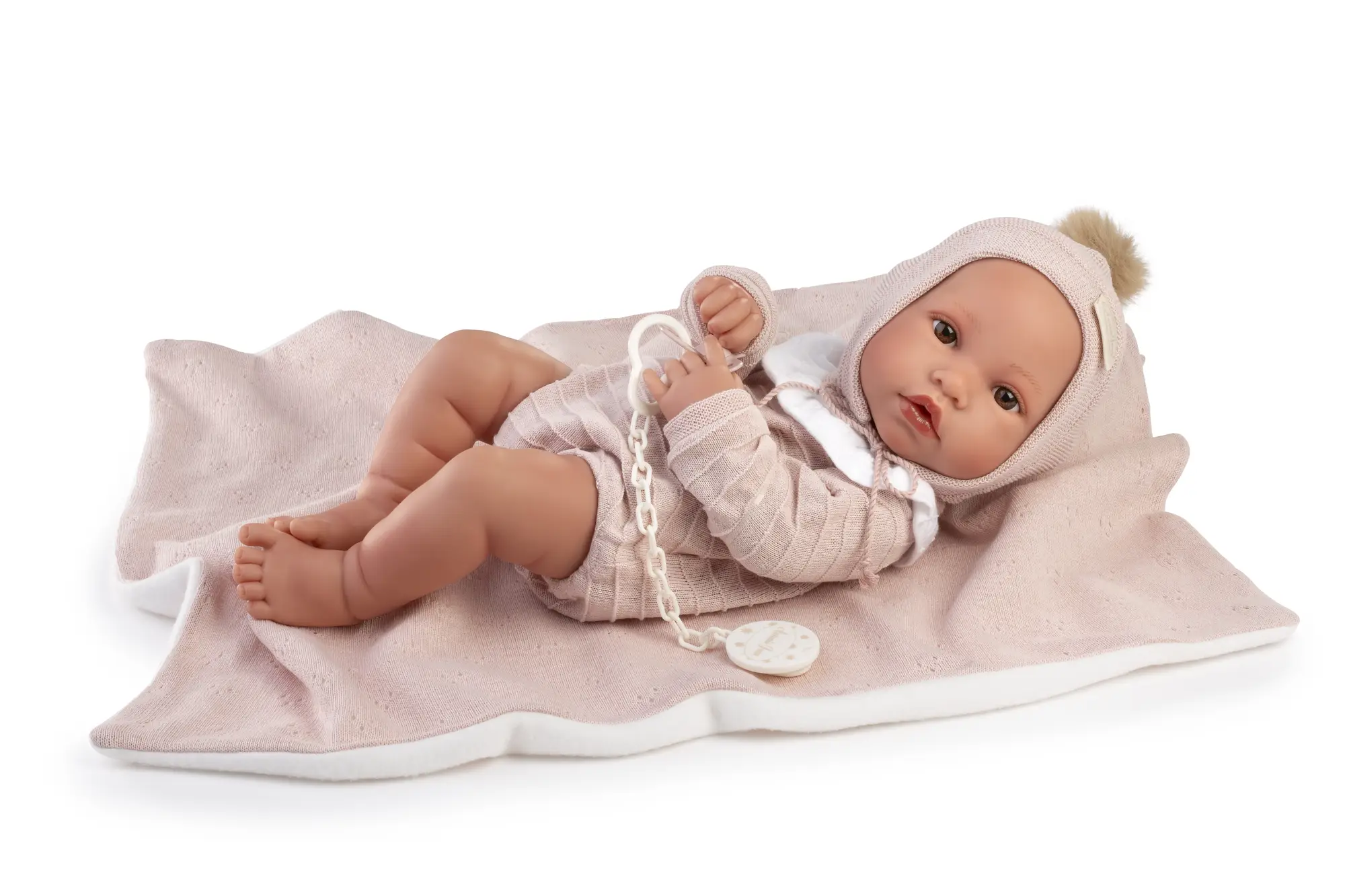 Muñeca Recién Nacida Erika Toquilla Rosa de Antonio Juan acostada, de 42 cm, con cuerpo de vinilo sexuado y tacto especial.